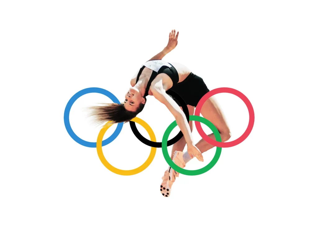 a female high jumper jumping over the olympic circles